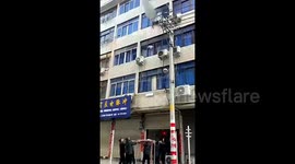 Good Samaritans catch baby thrown out of burning flat in eastern China