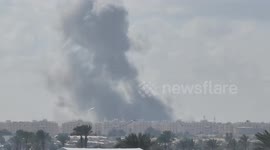 Residents preparing for the evacuation amid smoke and fire in Khan Yunis