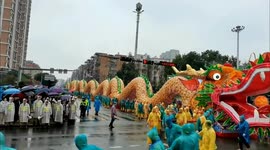 Dozens carry hundred-metre dragon in spectacular Chinese festival parade
