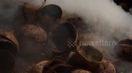 Coconut shells that will be in the burning process