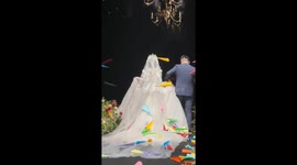 Wedding guests thrown paper planes at bride and groom