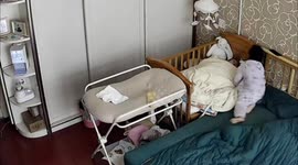 Chinese Preschooler steps up as 'little mom' for infant brother