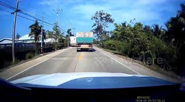 Pickup truck emerging from side road clips overtaking lorry