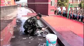 Controversy erupts as Chinese high school smashes phones in front of students