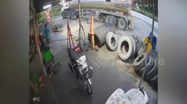 Truck tire explodes while mechanics look for leak