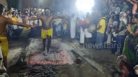 Daring devotees walk over burning embers during ritual in southern India