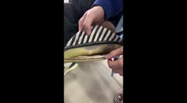 Resourceful man uses gum as adhesive to repair damaged slipper