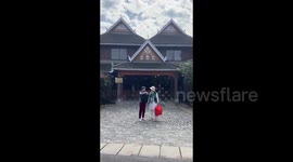 Tourists visit Manhena Ancient Village in Xishuangbanna, China