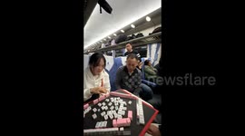 Passengers turn boring train ride into mahjong party on train in China