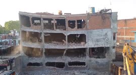 Locals pelt stones over demolition of illegal constructed building in Akbar Nagar, India