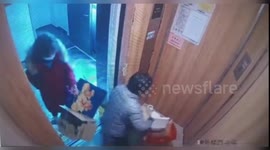 Pet poodle nearly chokes as leash gets trapped between moving lift doors