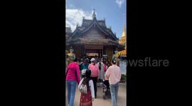 Tourists Visit Manchun Buddhist Temple in Xishuangbanna, China