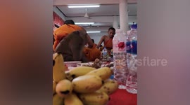 Chubby monkey joins Buddhist monks in feast