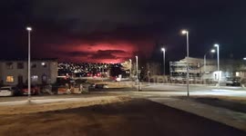 Volcano eruption glow lits up the sky in Reykjavík, Iceland