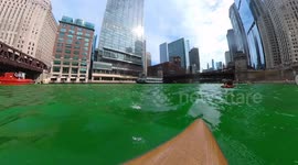 Water level view of Chicago River Dying Green in celebration of St. Patrick's day