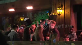 Thousands of Revellers paint the town Green White & Orange on the eve of St Patricks Day in Birmingham, England