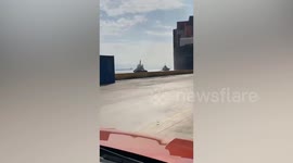 Cargo ship collides with gantry crane sending it crashing to the ground in Turkey
