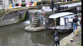 Canal boat passing through the Camden Lock, London, United Kingdom
