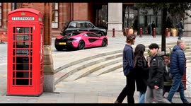 A Pink McLaren and Red Telephone Box outside of St Pancreas Renaissance Hotel, London, United Kingdom