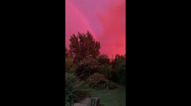 La Plata marvel: pink sky, lightning, and rainbow at dawn