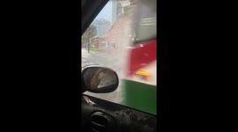 Flooded commute chaos: car takes on water in Buenos Aires, Argentina