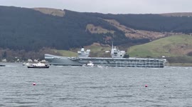 Aircraft carrier HMS Queen Elizabeth leaving Loch Long in Argyll Scotland