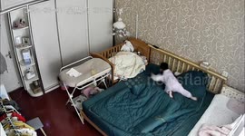 Little girl takes care of her sister in Taizhou, China