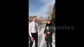Man takes a swim under ice in Beijing, China