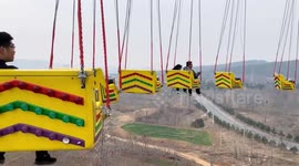 Tourists dangle mid-air when power cut stops fairground swing ride