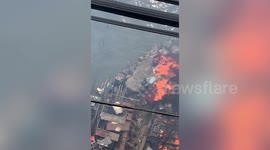 Hero resident swims into raging fire to save stranded pet dog