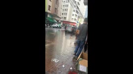 Cart puller accidentally dumps customer in large puddle