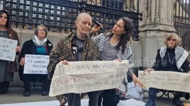 Women take a stand for Palestinians by shaving their hair off in front of the gates of Parliament