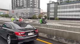 Heavy rain turns motorway into canal in Bangkok