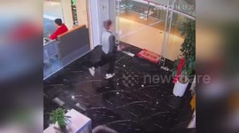 Hilarious moment man slips twice while trying to run across wet floor