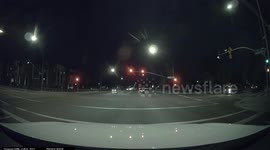 Close Call: Black Car Runs Red Light Nearly Involved in Serious Accident