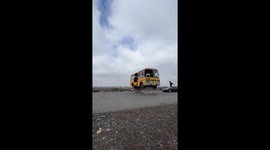 Dedicated daredevil crashes to ground in daring stunt jumping through open bus