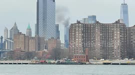 Smoke billows from building as Manhattan skyscraper catches fire