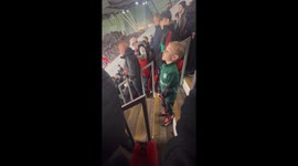 Young Manchester United fan celebrates goal at his first game at Old Trafford