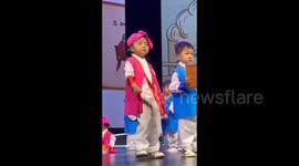 Sleepy kindergartener keeps dosing off while performing