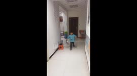 Mischievous Prank: Energetic Chinese Boy Startles Dad