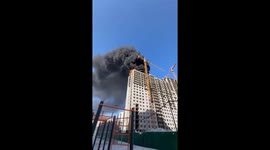 Dark smoke billows from fire on top floor of Moscow high-rise under construction