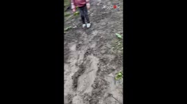 Muddy patch sparks a giggle-filled adventure for young girl and her dad
