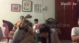 Young horror movie buff belts out a piercing scream after watching a frightening scene
