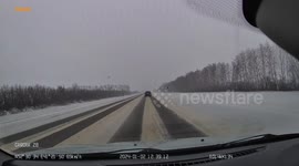 Close Call: Car Loses Control On Icy Road Due To Hydroplaning
