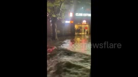Floating cars and residential areas under water after flooding in Buenos Aires, Argentina