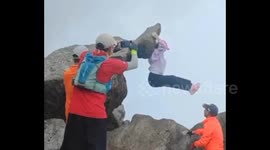 Chinese tourist luckily saved after terrifying mountaintop slip and fall