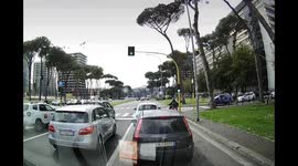 Tree crushes vehicles and traffic light in Rome