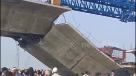 One dead and 30 feared trapped as under-construction bridge collapses in north India