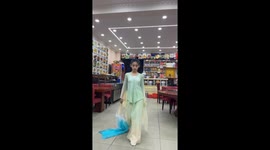 Young Chinese Girl Performs Graceful Dance in Family's Restaurant