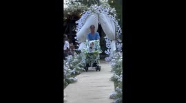 Pampered pet dog is banner bearer at couple's wedding